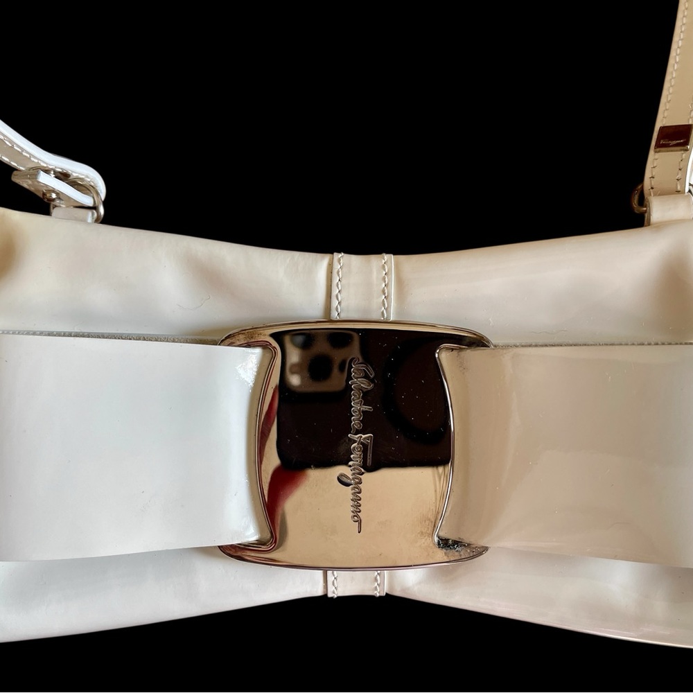 Salvatore Ferragamo White Bow Patent Leather Clutch.